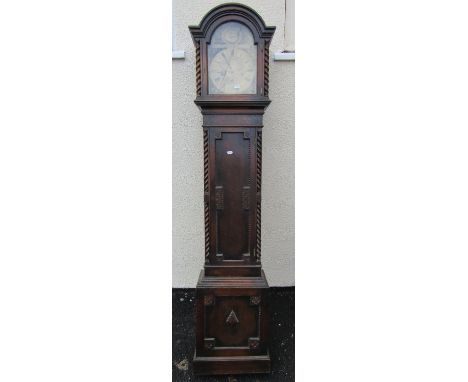 An Edwardian oak grandmother clock with arched brass dial and engraved detail, enclosing a three train movement, together wit