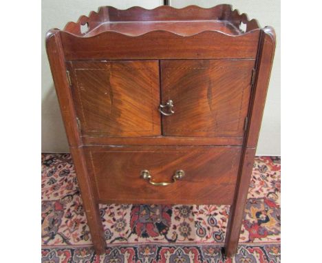 A Georgian mahogany tray top commode, the front elevation enclosed by the original pull out base, enclosed by two further pan