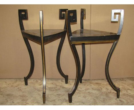 A pair of decorative Regency style ebonised occasional tables of triangular form with Greek key and gilt painted line detail 