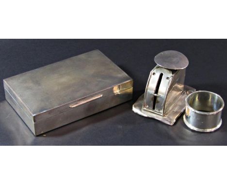 A silver engine turned cigarette box, Birmingham 1961, maker Turner &amp; Simpson, a silver letter scale and a napkin ring (3