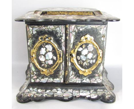 A 19th century black lacquer and mother of pearl cabinet with drawers to the interior. 30cm wide x 27cm high. (With key) 