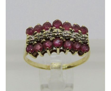 Yellow metal triple row ruby and diamond ring, size J, 2.2g 