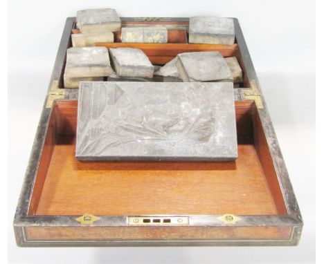 A 19th century writing box in need of restoration, and a collection of architectural wood printing blocks. 