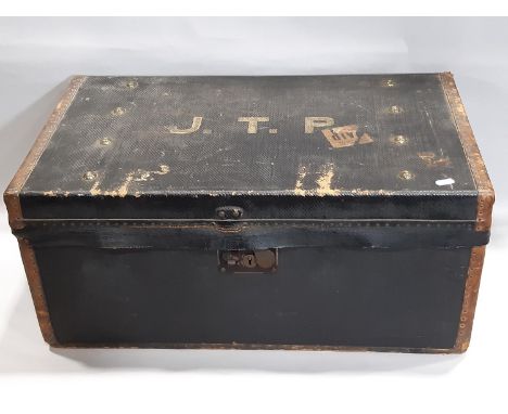 A vintage wooden and overlaid travelling trunk with leather reinforced corners labelled to interior W M Insall &amp; Sons man