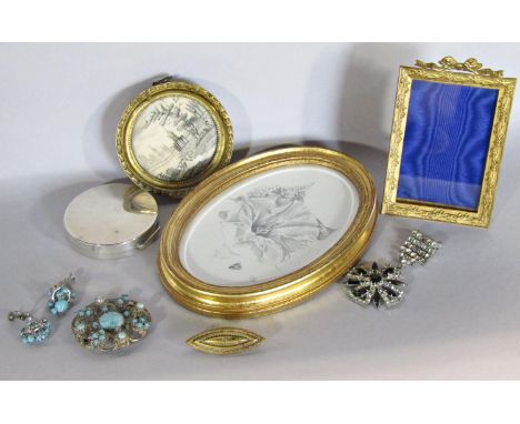 A collection of compacts to include a small hallmarked silver example, together with an early 19th century circular hand work