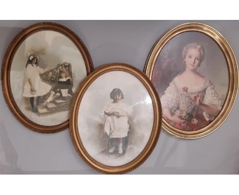 Three oval framed prints: Two hand-tinted 19th century photographs of children, signed Clematis Ward Hounslow in pencil below