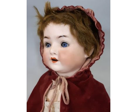 3 dolls: an early 20th century bisque head German character doll by Ernst Heubach with jointed composition body, blue eyes, o