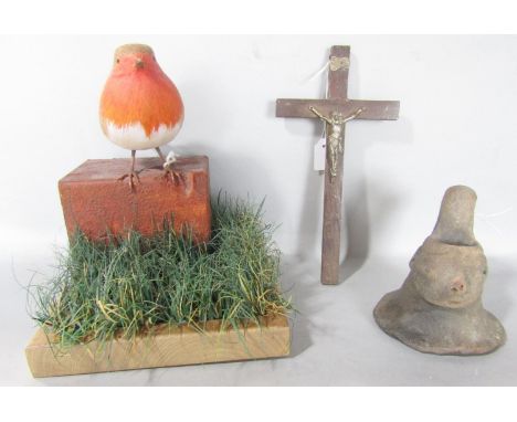 A ceramic souvenir Huaco vessel from Peru circa 1940’s see accompanying letter, together with a model Robin set on a brick an