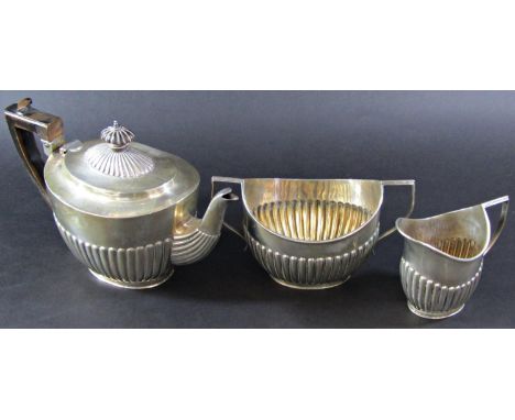 A silver three piece tea service, London 1897, makers mark rubbed, 26 ozs all in 
