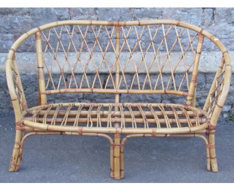 A two seat cane work sofa with bound lattice detail, 130cm wide approx 