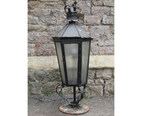 An old exterior lantern of hexagonal form with glazed panels beneath a crown finial, 1 metre high approximately (af) 