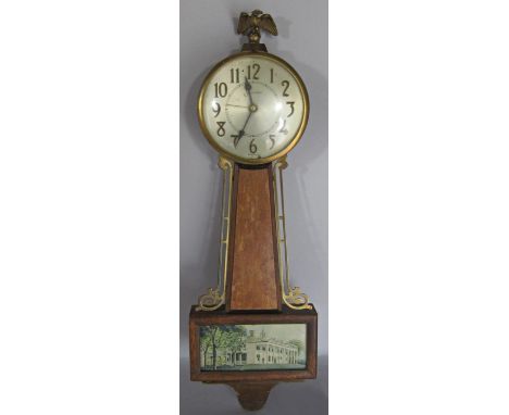 An American style banjo wall clock by Sessions with eagle surmount 
