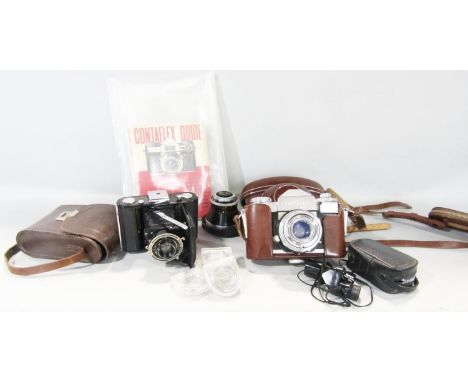 A Zeiss Contaflex camera circa 1950’s in it’s original case and manual together with associate lens, and another Zeiss Ikon c