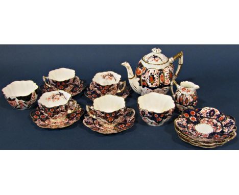 A Shelley and Wileman Japan ware part tea set comprising teapot, two sugar bowls, milk jug, four tea cups and eight saucers 