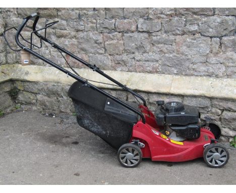 A Mountfield RS100 petrol driven rotary lawn mower and grass collection bag 