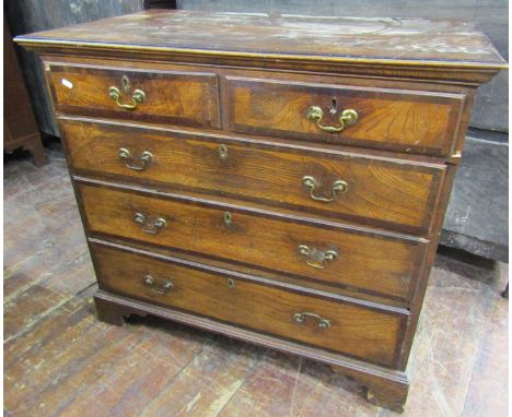 A Georgian countrymade chest of three long and two short drawers, principally in ash, cross banded in walnut, with original b