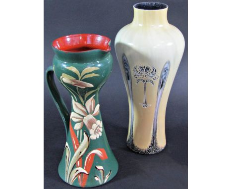 An Art Nouveau style pale yellow glass vase with stylised floral motif, 23cm high, and a charming clay turned vase/jug with a