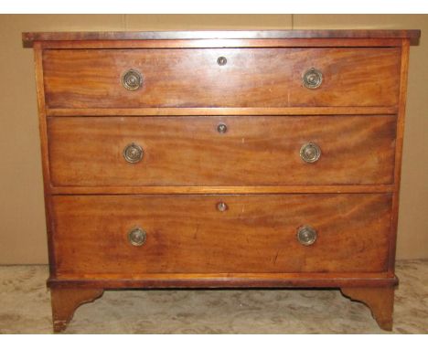 A small 19th century mahogany bedroom chest of three long graduated drawers raised on bracket feet, 95 cm wide x 50 cm deep x