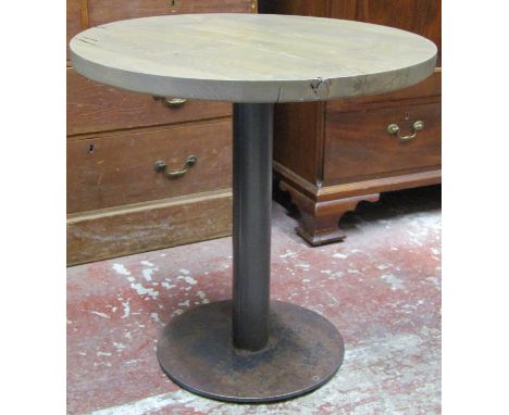A pair of good quality restaurant tables, the circular oak tops raised on a steel central pillar and platform bases, to seat 