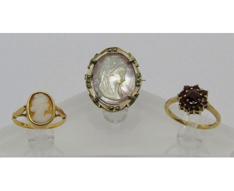 Group of jewellery comprising an 18ct cameo ring, 2g, a 9ct garnet cluster ring, 2.3g and an 800 silver mother of pearl cameo