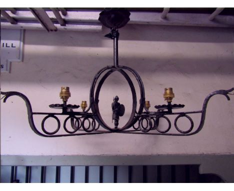 An unusual ironwork hanging ceiling light, the looped X frame in the form of two longboats supporting four light fittings, ce