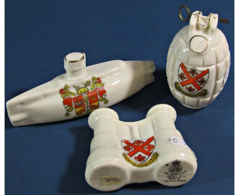 Six crested ware pieces with military significance, to include a tank, an ambulance, an armoured car, submarine, a hand grena