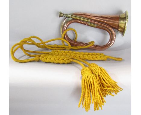 A copper and brass bugle from the “ Church Lads Brigade” 13 Craven Street, and yellow tassel lanyard. 