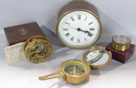 A brass cased marine clock with porthole style case, 19th century three drawer brass telescope, a reproduction brass cased co