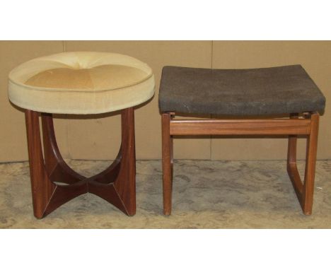 Two vintage G-Plan dressing stools of various design raised on shaped and moulded teak supports 