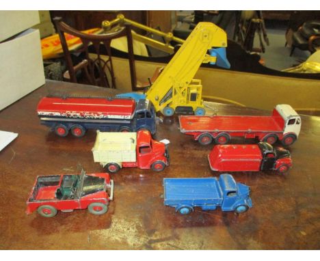 Seven vintage Dinky toys to include a Dinky Foden tanker, an elevator loader, a Foden flat bed truck, a Bedford tipper, a Lan