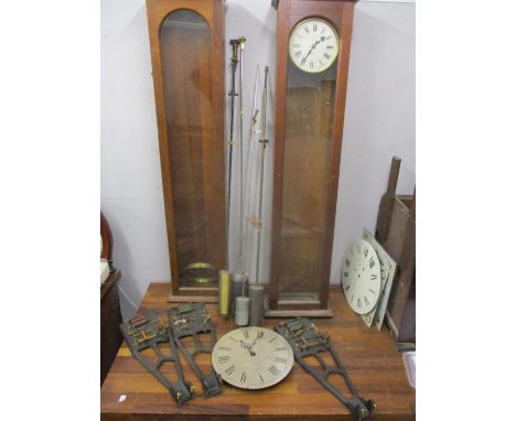 Synchronome electric clock parts to include two cases, three movements, four pendulums and a dial Location: G 