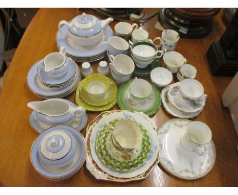 A Doulton tea service, four dinner plates and salt and pepper shakers, together with mixed teacups and saucers to include the