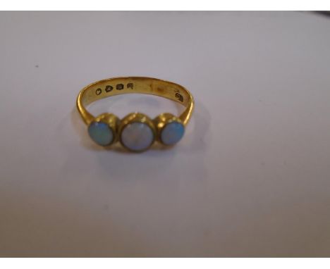 A Victorian yellow metal and opal three stone ring, Sheffield 1853, total weight 3.1gLocation: Cab 