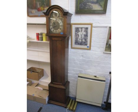 A 1930s oak long case clock with a gong strike movement, St Michael, Westminster and Whittington, an arched hood and box base