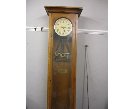 An oak Synchronised electric clock case and movement along with a pendulum A/FLocation: G 