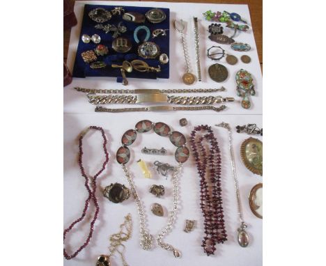 Costume jewellery to include a 19th century mourning brooch, three white metal identity bracelets, four vintage enamelled bro