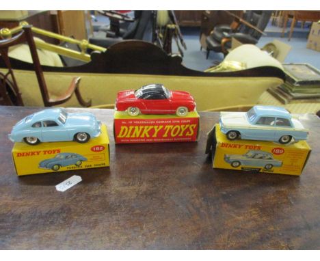 Three vintage Dinky cars with original boxes to include a 189 Triumph Herald, 187 Volkswagen Karmann Ghia Coupe, and a 182 Po