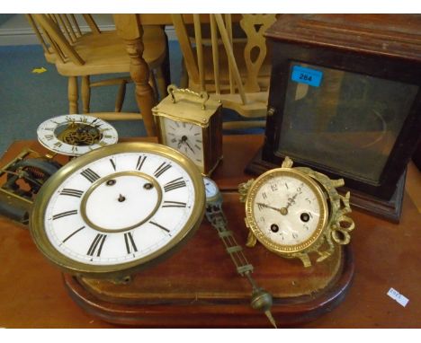 A small lot of clocks, clock movements and associated parts to include a Junghans swinging clock and othersLocation: FSL 