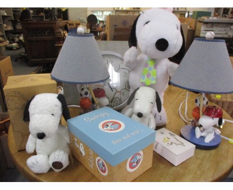 A pair of 2011 composition table lamps, 46cm high, in the form of Snoopy holding a baseball bat next to three American balls 