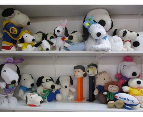 A quantity of late 20th century and later Snoopy soft toys to include three battery operated Snoopy toys manufactured by Pean