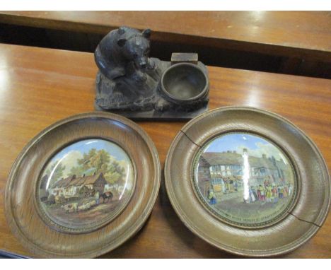 A Black Forest carved inkwell, with bear perched on a tree trunk together with two Prattware pot lids each depicting Shakespe