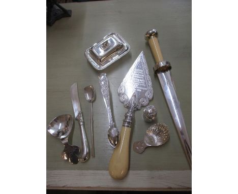 A small quantity of miscellaneous silver ware to include a Boston Harbour commemorative dagger, a cake slice and caddy spoons