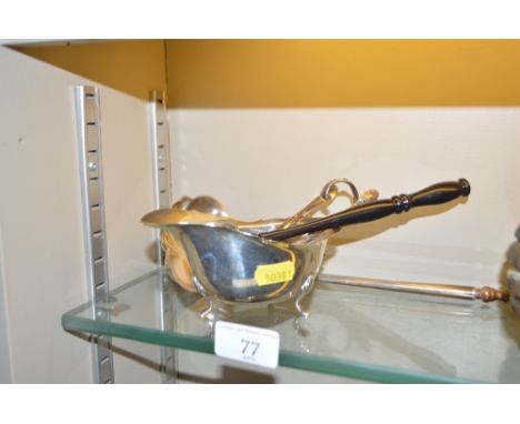 A toddy ladle together with a pair of silver sugar nips; a silver candle snuffer and a silver sauce boat