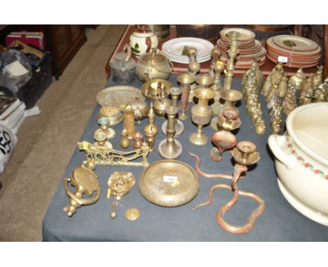 A quantity of various brassware to include a lion mask door knocker; miniature jugs; vases; candle sticks etc