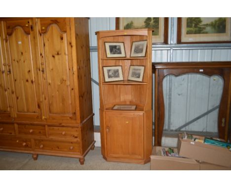 A light "Ercol" corner cupboard