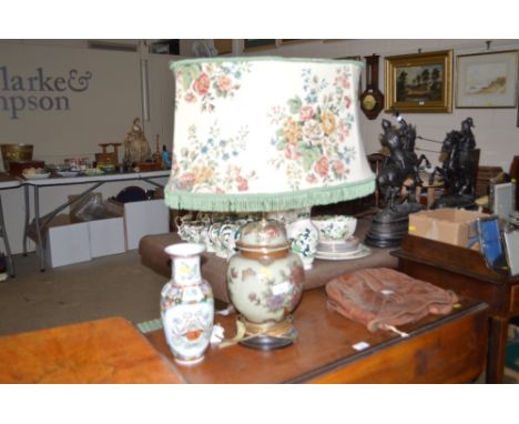 An oriental table lamp and vase