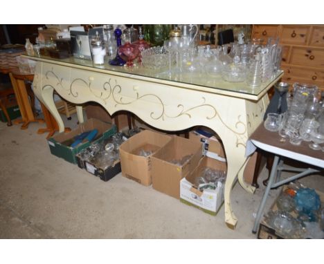 A large decorated console table with single drawer and faux marble top