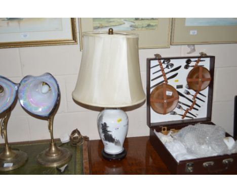 An oriental decorated table lamp and shade