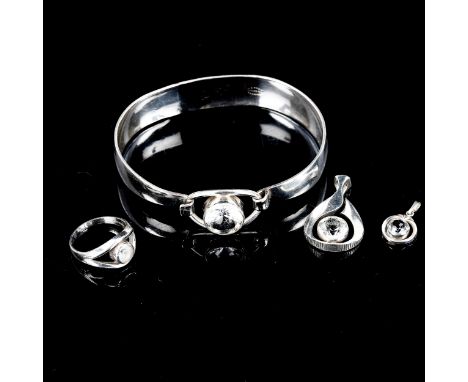 4 Scandinavian sterling silver cubic zirconia items of jewellery, comprising torque bangle, ring and 2 pendants, bangle inter