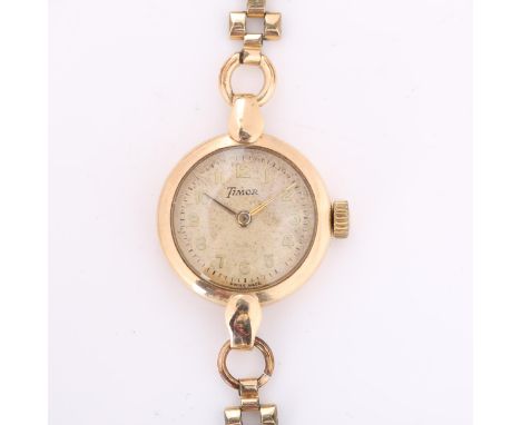 TIMOR - a lady's Vintage 9ct gold mechanical wristwatch, silvered dial with gilt Arabic numerals and rolled gold strap, case 